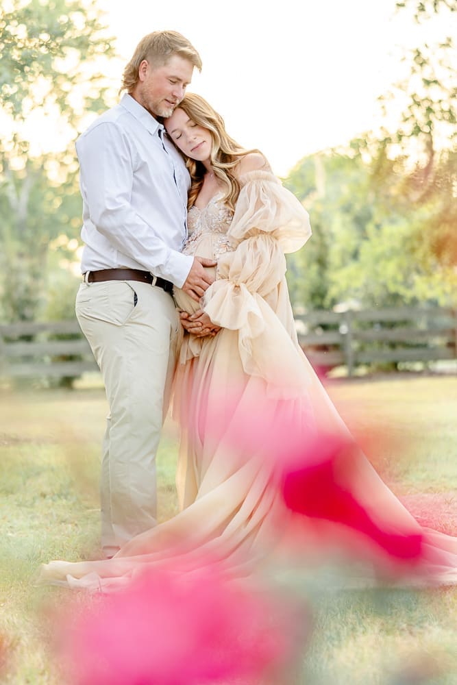 husband and wife holding one another